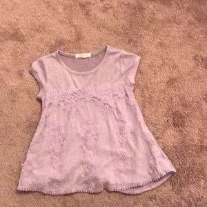 This is a light violet loose comfortable shirt